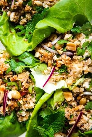 Tofu Lettuce wraps shown close up on a white platter.