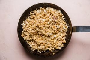 seasoned crumbled tofu shown in a large skillet