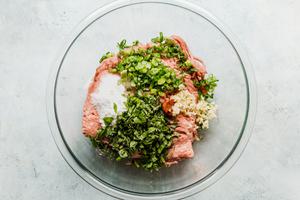 ground turkey, basil, red curry paste and garlic in a large glass bowl