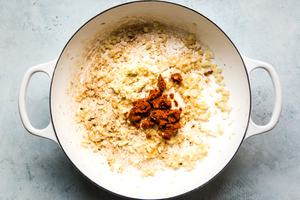 garlic, and curry pasted browned in a large white skillet