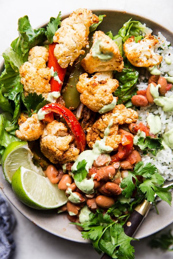 vegetarian burrito bowl with cauliflower and avocado crema