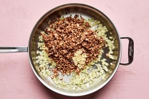 onion, garlic and minced mushrooms cooking in a pan