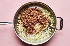 onion, garlic and minced mushrooms cooking in a pan