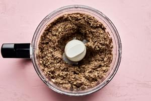 cooked mushroom and onions, and tender lentils being pulsed in a food processor