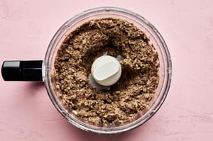 cooked mushroom and onions, and tender lentils being pulsed in a food processor