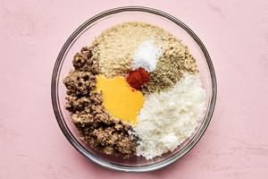 mushroom & lentil mixture in a bowl with panko, spices, eggs and Parmesan to make vegetarian meatballs