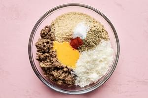 mushroom & lentil mixture in a bowl with panko, spices, eggs and Parmesan to make vegetarian meatballs