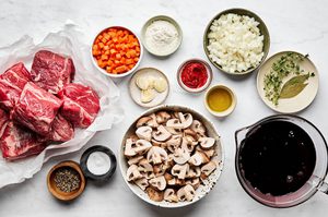 ingredients prepped and laid out to make wine braised beef with mushrooms, an elegant hearty dinner