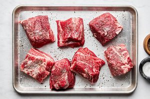 chuck roast pieces patted dry and seasoned with salt, ready to browned