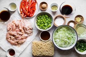 raw chicken, chow mein noodles, soy sauce, oil, cabbage, celery, noodles, garlic, green onions and bell peppers.