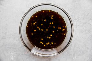oyster sauce, soy sauce, rice vinegar, brown sugar and chili sauce stirred together in a bowl
