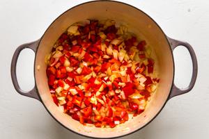 red peppers and onions in a large pot