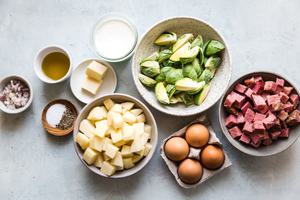 corned beef, potatoes, brussels sprouts, shallots, cream, worcestershire, butter and spices in prep bowls