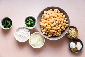 chickpeas, onions, garlic, parsley, cilantro, cayenne, cumin, salt, baking powder and flour in small bowls to make falafel