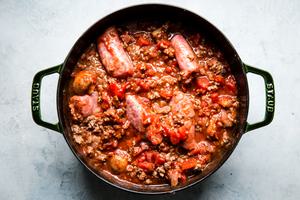 ground beef, ground pork, mushrooms, onions and garlic cooked in a pot with sausage links, spices, tomatoes and tomato sauce
