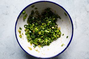 green onions, Ginger, minced, Garlic, soy sauce, rice vinegar, fish sauce, vegetable oil mixed together in a small bowl