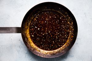 brown sugar Asian bbq sauce with Sriracha, garlic, ginger and soy sauce mixed together in a sauce pan