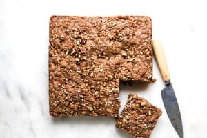 Apple Crumb Cake with a piece cut from the corner with a knife sitting beside it