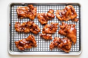 BBQ Chicken Thighs baked on a wire rack in the oven