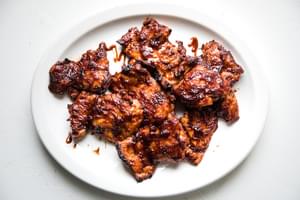Baked BBQ Chicken Thighs on a white platter