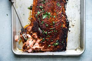 baked salmon a baking sheet seasoned with brown sugar, salt, paprika, garlic powder and pepper