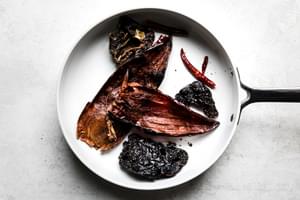 seeded, dried chiles being toasted in a dry skillet to use for beef birria