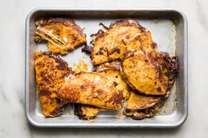 crispy, cheesy beef birria tacos on a baking sheet