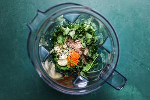 cilantro, garlic, olive oil, orange zest, orange juice, honey, salt, blackened seasoning and fresh ginger in food processor