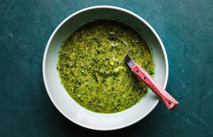 cilantro, garlic, orange, honey and fresh ginger sauce in a bowl