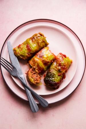 Warm Polish cabbage rolls stuffed with ground beef, sausage and rice, baked to perfection, topped with ketchup & crisp bacon.