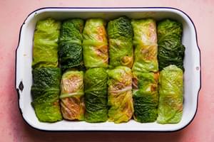 Polish cabbage rolls stuffed with seasoned ground beef, sausage & rice and in a casserole dish