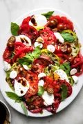 homemade caprese salad made with mozzarella, tomatoes, basil and balsamic
