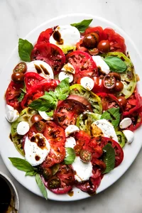 homemade caprese salad made with mozzarella, tomatoes, basil and balsamic