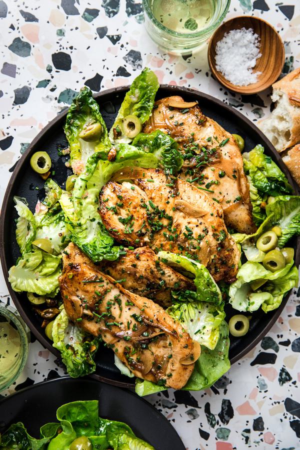 homemade chicken paillard on a plate with a salad