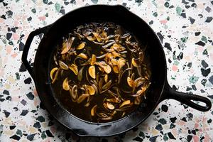 garlic and shallots caramelized in a cast iron skillet with chicken stock and lemon juice