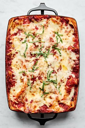 a pan of classic lasagna made with meat sauce, mozzarella, Parmesan, ricotta, and al dente lasagna noodles
