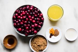 Fresh cranberries, Apple cider vinegar, brown sugar, cloves, cinnamon, salt, vanilla & orange juice and zest in prep bowls