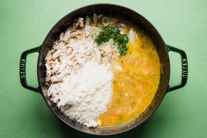 Chicken parmesan cheese, dill, vegetables, for creamy chicken soup in a pot