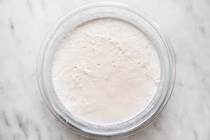 eggs, milk, cream, bourbon, rum and nutmeg blended in a glass bowl