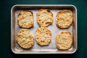 toasted English muffins on a baking