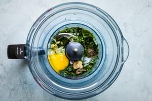 egg yolk, garlic, Dijon, anchovy paste, salt, minced fresh herbs, lemon juice and olive oil in a small food processor