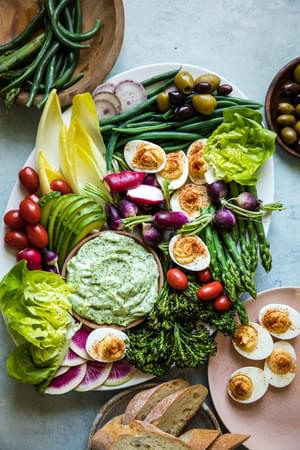 green goddess aioli spread with vegetables on a plate