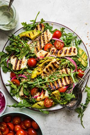Grilled Halloumi Salad with arugula, pickled onions, avocado, tomatoes and creamy basil dressing