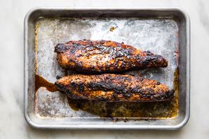 grilled pork tenderloin on a baking sheet