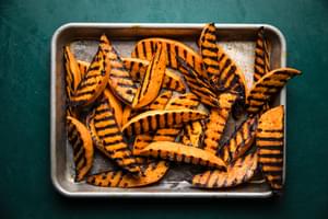 grilled sweet potatoes on a sheet pan