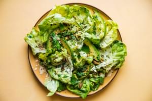 Herby Seedy Butter Lettuce Salad with Tahini Dressing on a plate