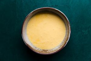 a bowl of homemade hollandaise sauce made with egg yolks, butter and fresh lemon juice