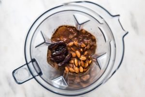 soaked almonds, water, vanilla, cinnamon, and dates in a blender for homemade almond milk