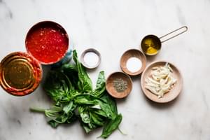 Fresh basil, crushed tomatoes, salt, sugar, Italian seasoning, garlic and olive oil for homemade marinara sauce