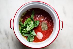 canned crushed tomatoes, fresh basil, salt, Italian seasoning, garlic and olive oil in a large sauce pan